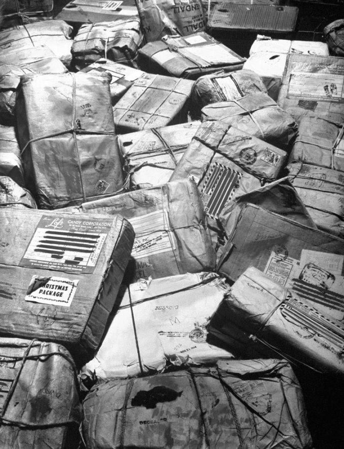 Christmas packages destined for soldiers who have been killed or reported missing in action await "return to sender" stamps. New York City, 1944.