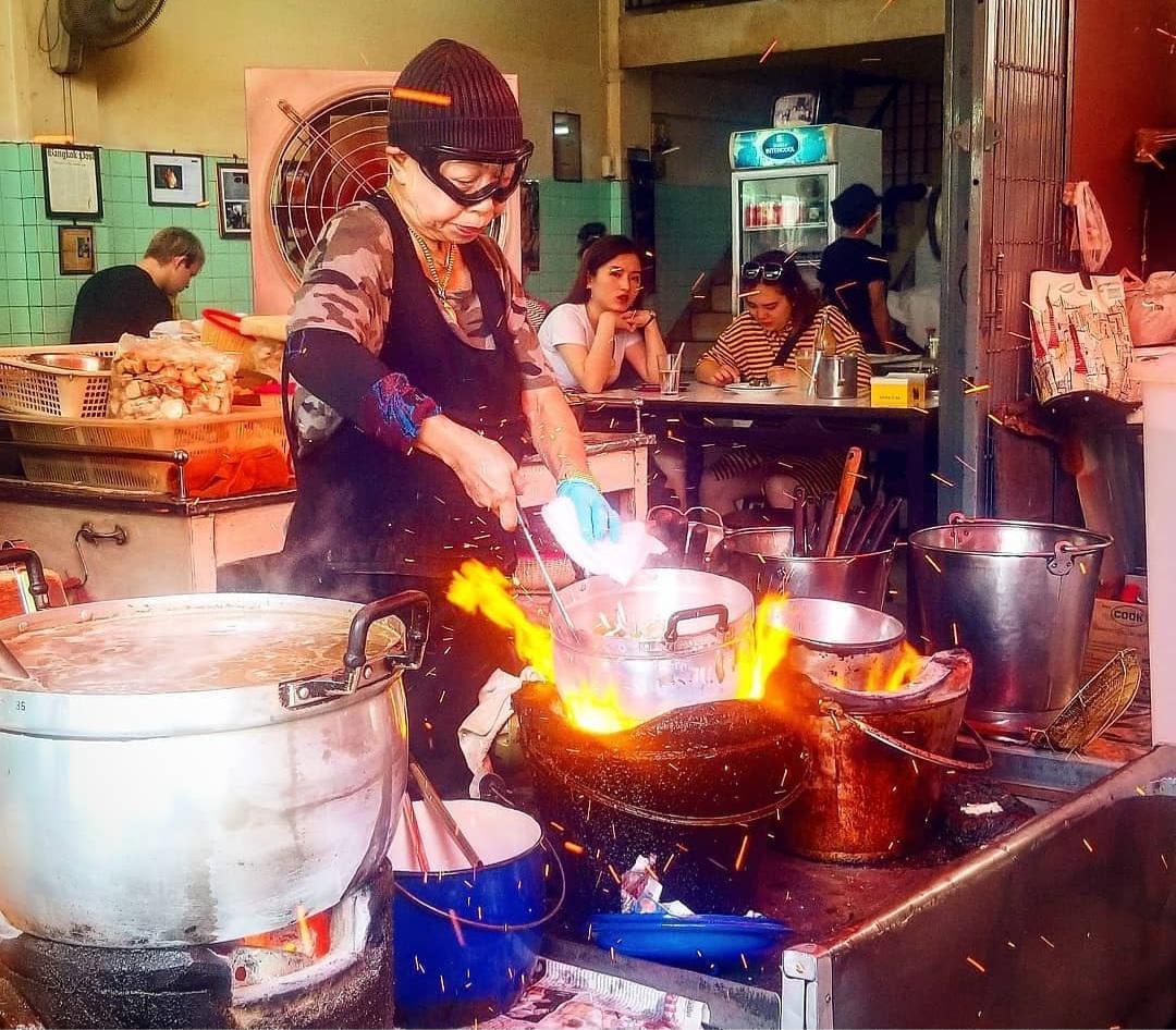 Street food legend Jay Fai preparing Tom Yum.