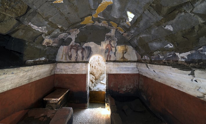 From the Archives: The interior of a 2nd-century B.C. Oscan tomb, discovered in a necropolis at Cumae in southern Italy, was painted with vibrant landscapes and a banquet scene above the entrance.