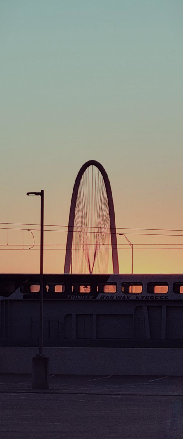 Trinity Railway Express passing in front of MHH Bridge, Dallas TX [oc]
