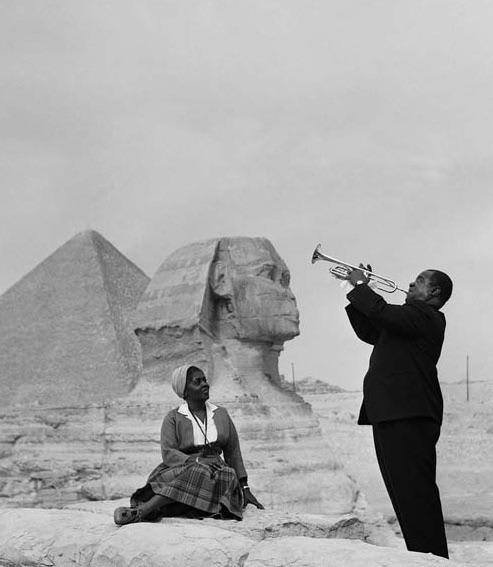 Louis Armstrong plays for his wife in front of the Sphinx by the pyramids in Giza, 1961