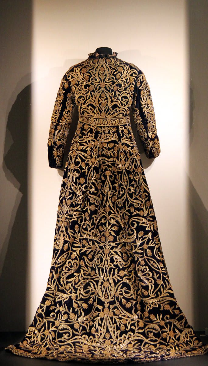 This magnificent 19th-century garment was probably worn by a female member of the Ottoman court in Turkey. Made of velvet, it is embroidered with gold arabesque motifs – a common design in Islamic art.