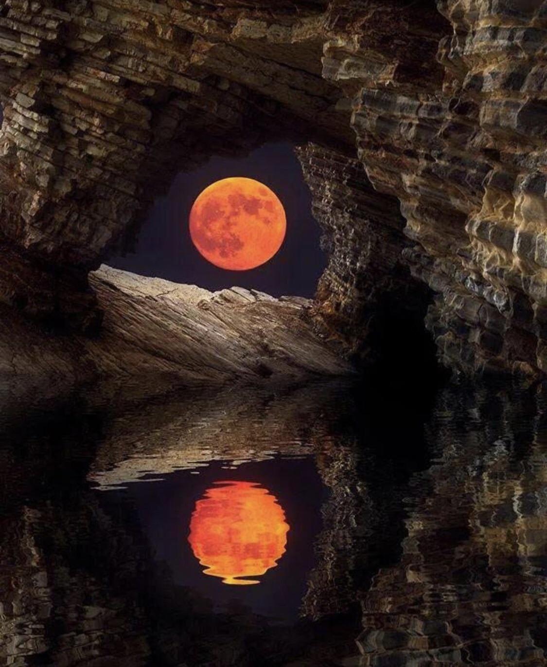 Moon reflected in a sea cave