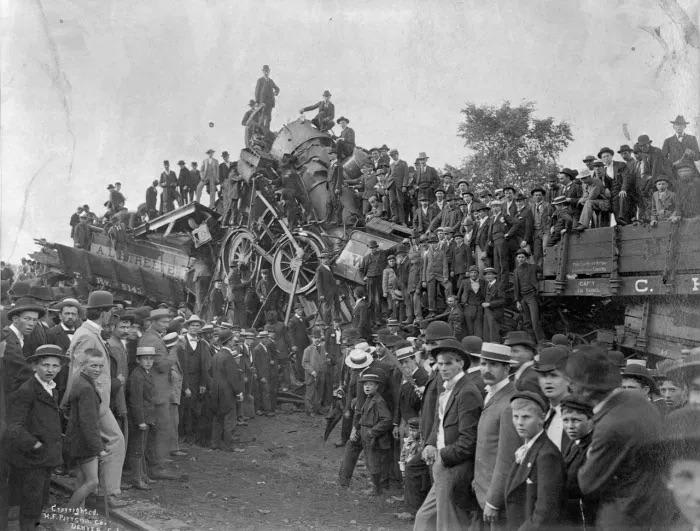 The Great Collision at Crush, September 15, 1896. Spectators stand upon the wreckage of two steam trains that were intentionally crashed together by the M.K&T Railway company
