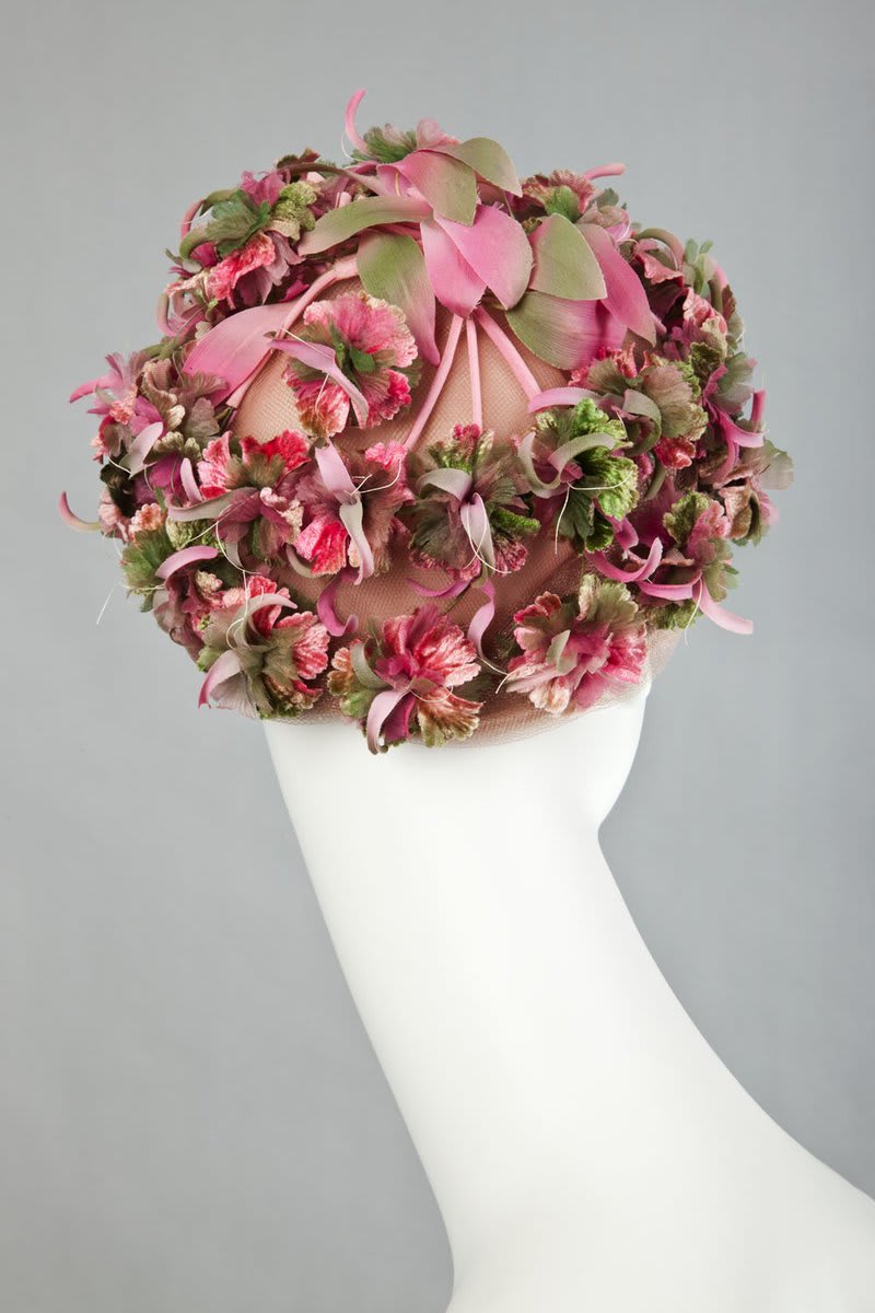 ....this distinct floral hat, another Schiaparelli design. For more of Elsa's work from our collection: