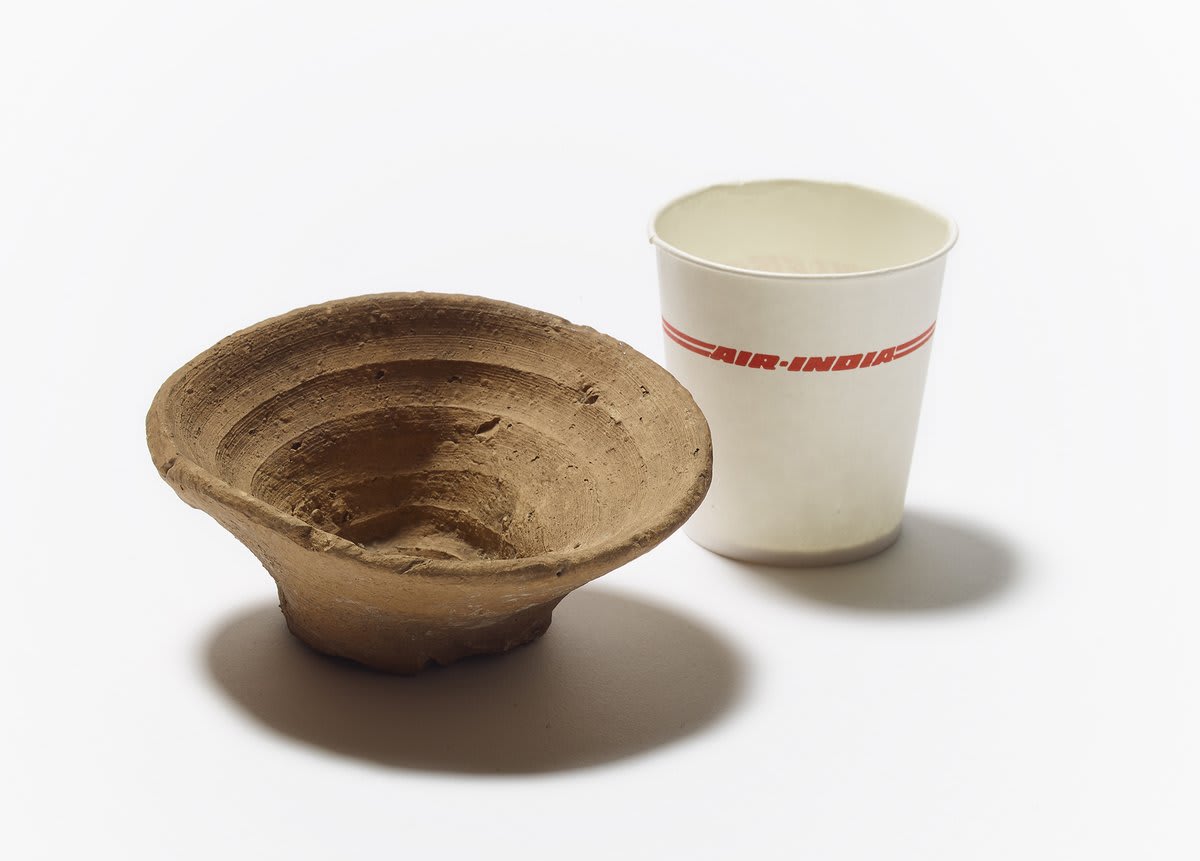 On display in our free exhibition are two very different single-use cups. One is a waxed-paper cup, made for Air India in the 1990s, and the other was made around 3,500 years ago for feasts on the island of Crete