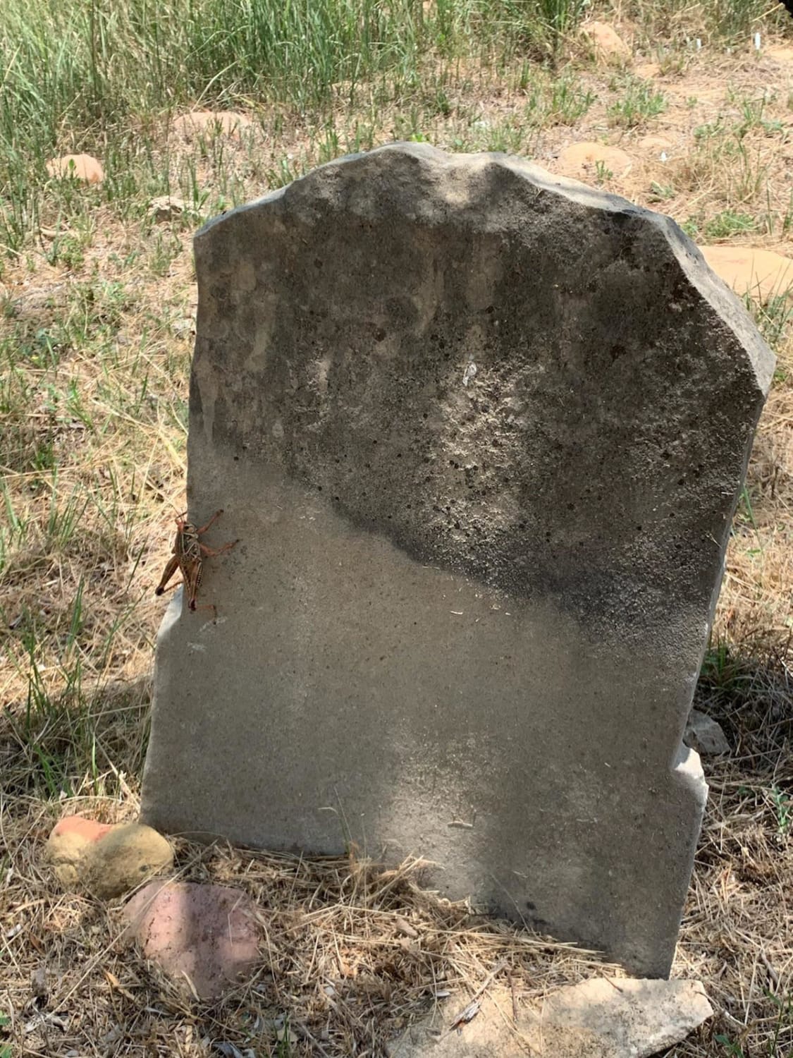 Found what looks to be an old tombstone on our ranch in Throckmorton, Texas. What are the chances this is a natural occurrence vs man made.