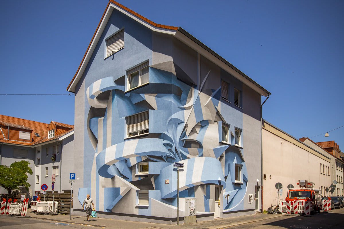 Italian artist Peeta blends graffiti and abstract forms into optical illusion murals