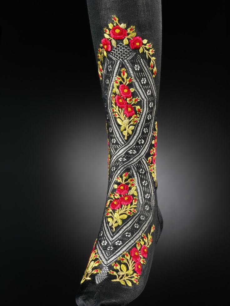 Another gorgeous piece of undergarment history- elaborately embroidered stocking, circa 1900. Via