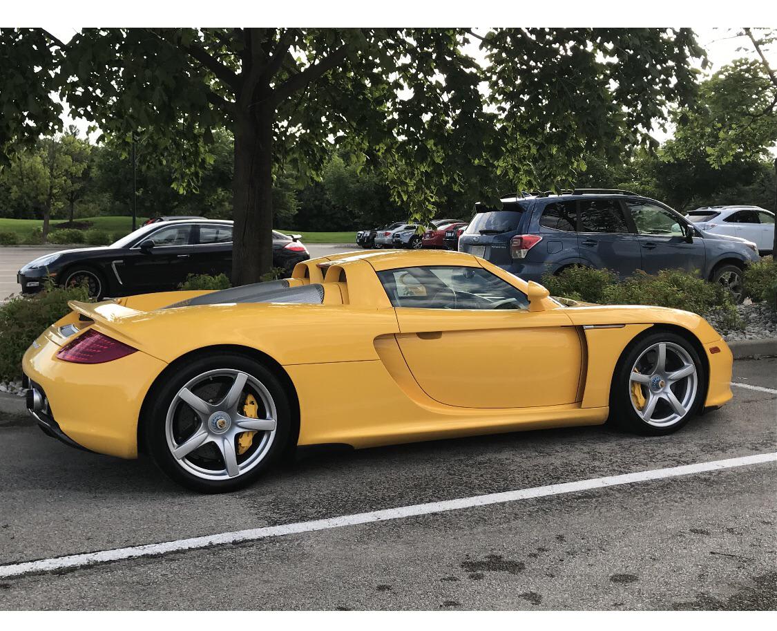 Going through old pics from 2019 at my golf course parking lot. Yellow Carrera GT