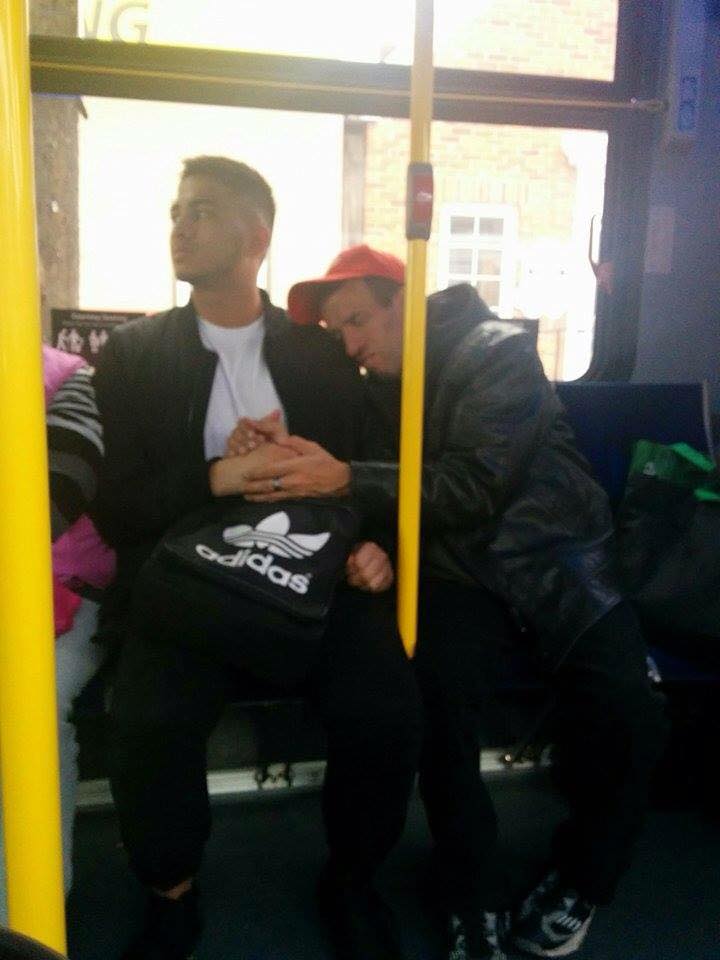 Man allows special needs person he doesn't know to hold his hand on a crowded bus
