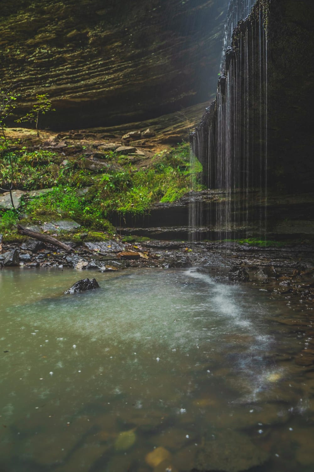 Rainy day under a waterfall in the Arkansas Ozarks