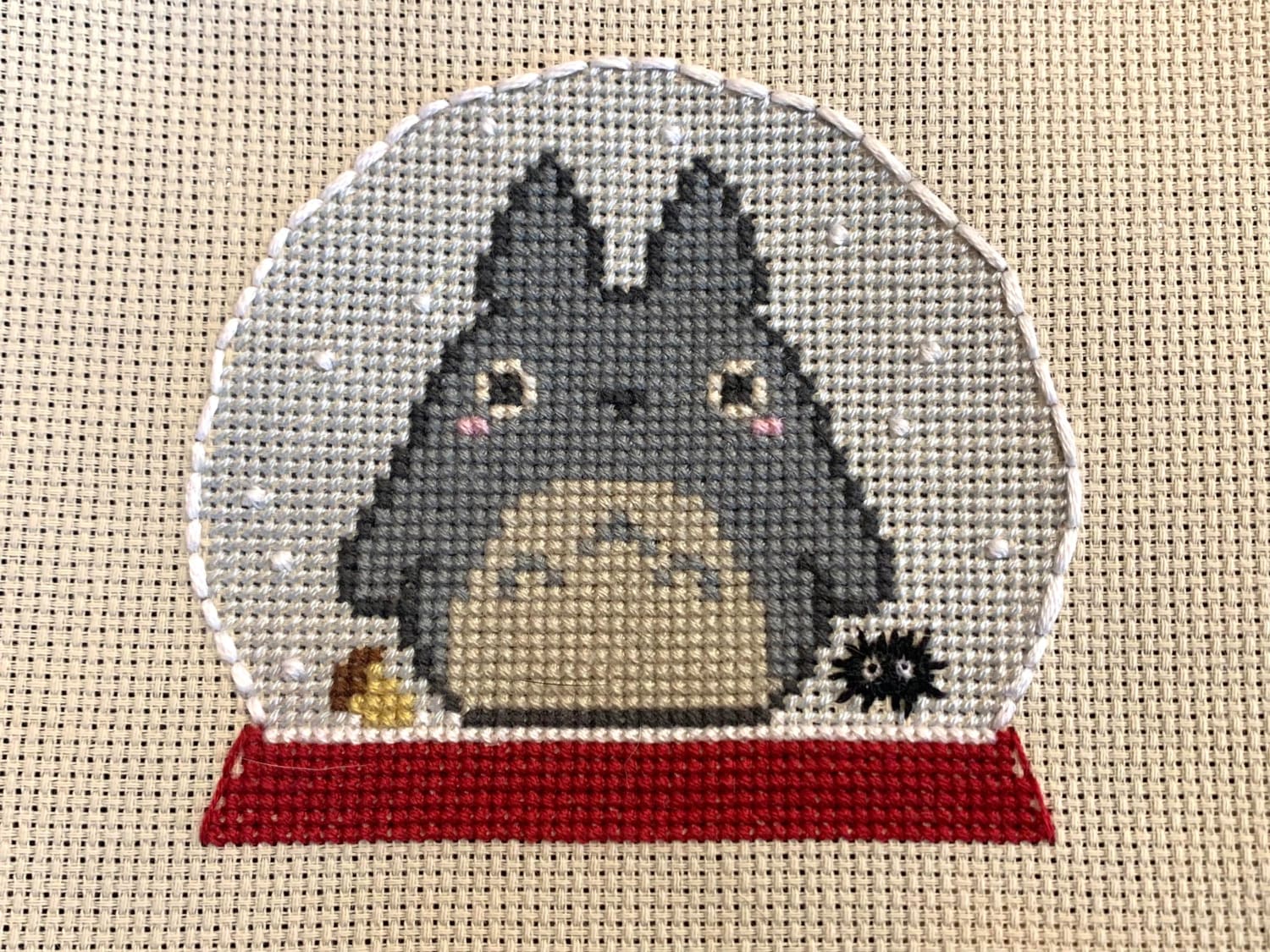 [FO] my six year old requested “a Totoro in a snow globe!” Totoro’s outline is from crossstitch4free.com, the rest was me winging it. I redid the globe three times before I was happy. She won’t stop hugging it :D