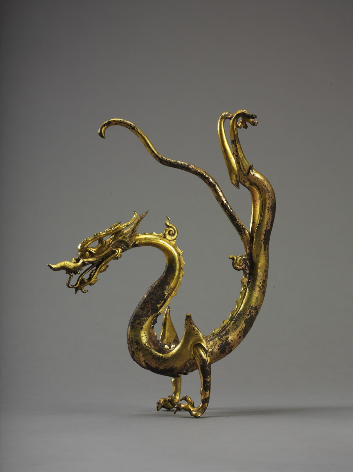 Gilded Bronze Dragon from Tang Dynasty, unearthed from Caochangpo in the southern suburb of Xian in 1975. 7th-10th century China. Shaanxi History Museum.