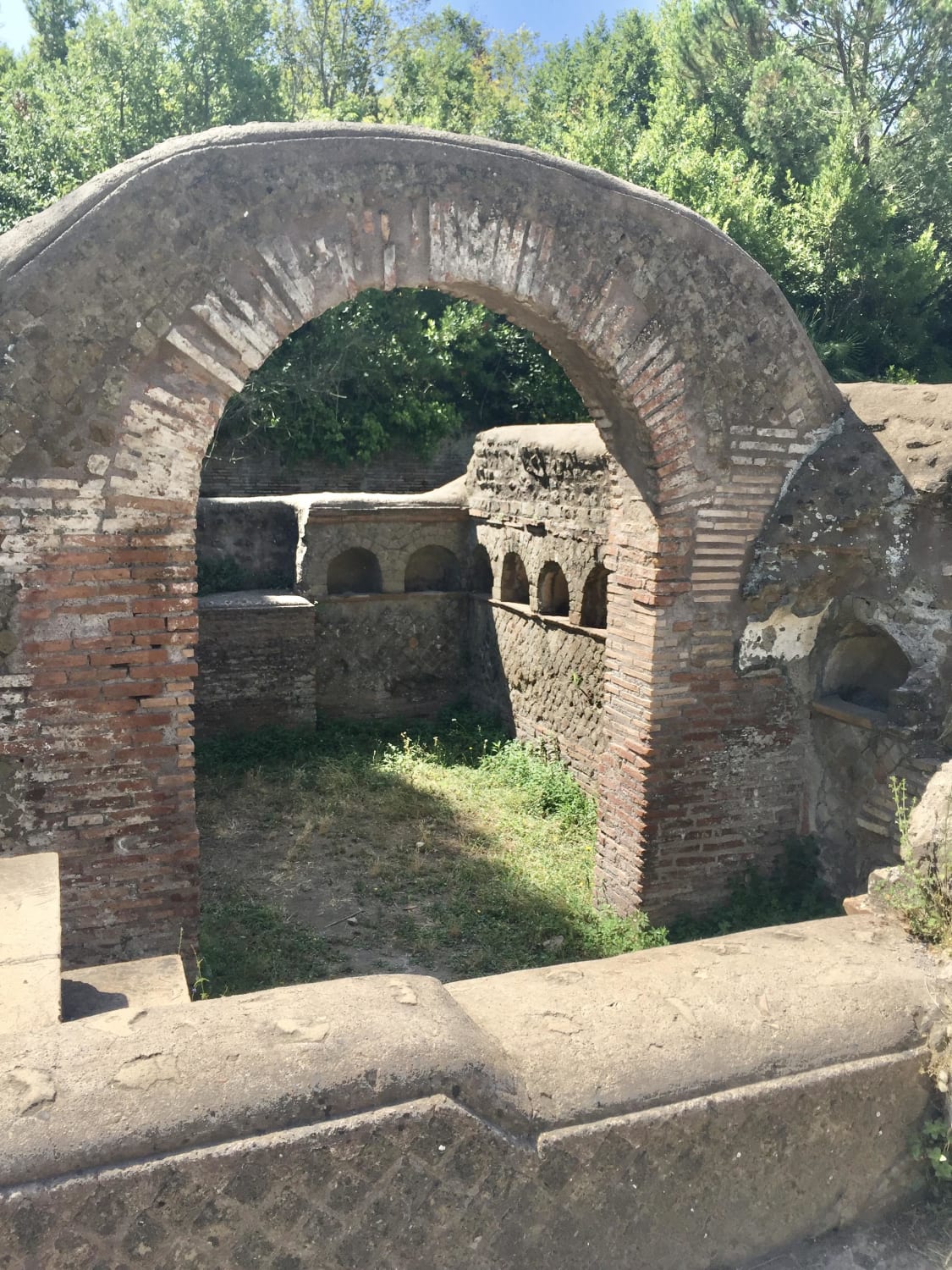 Roman columbarium on the Via Ostiensis, a two-story family tomb with niches for crematory urns. It contains a staircase, leading to a terrace which was used for funerary banquets. The courtyard features an ustrinum, the area where the deceased were burned. c.1st century CE, Ostia, Italy.