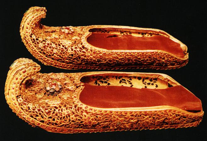 19th century gold shoes encrusted with gems, from the Burmese Royal Regalia. Now on display at the National Museum of Myanmar