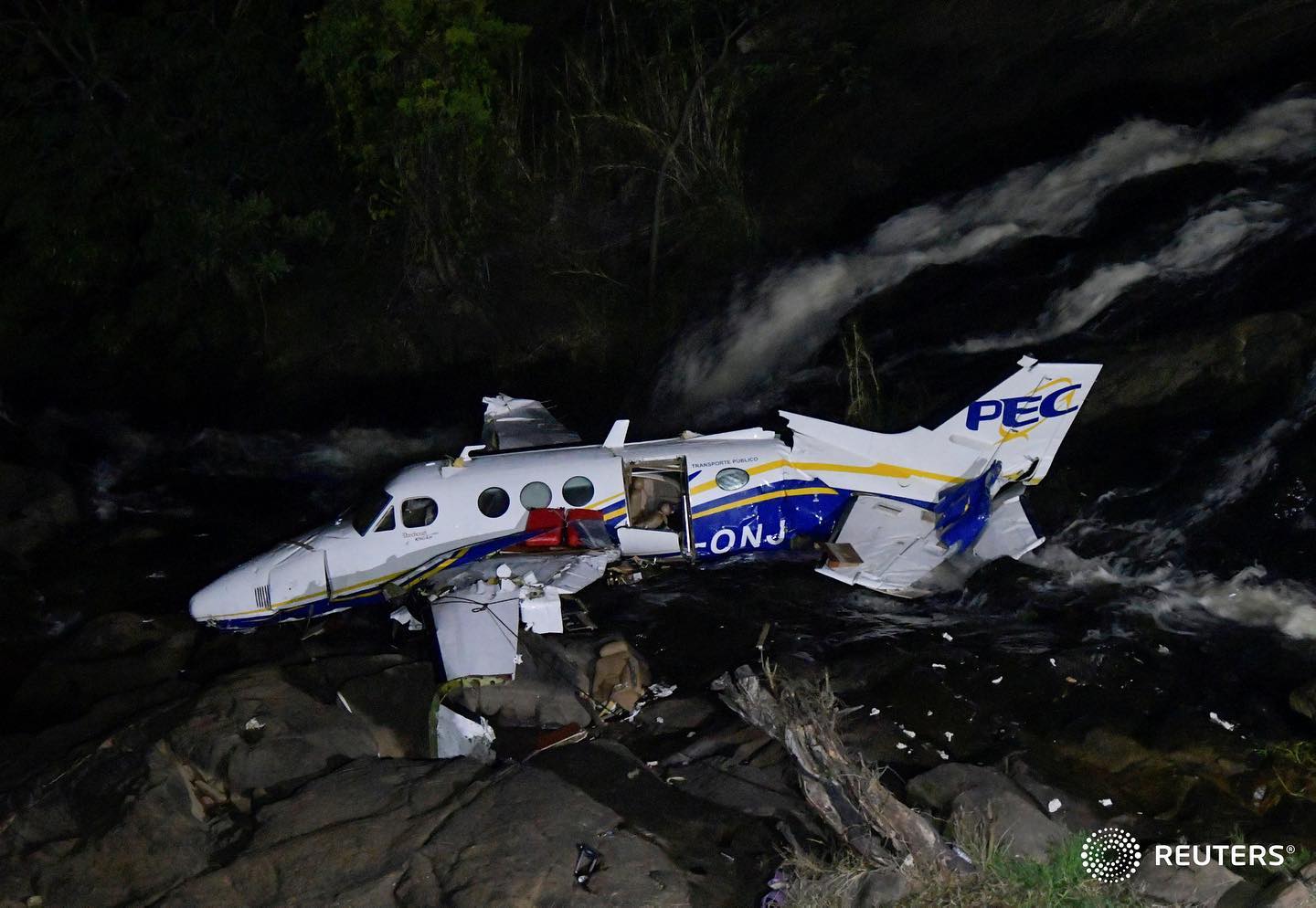 The wreckage of a small airplane that crashed with Brazilian country singer Marilia Mendonca, 26, aboard lies near a waterfall area in Piedade de Caratinga, state of Minas Gerais, Brazil, November 5, 2021 (Source: Reuters).