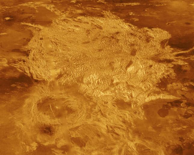 Part of Alpha Regio is shown in this three-dimensional perspective view of the surface of Venus. Alpha Regio, a topographic plateau approximately 1,300 kilometers in diameter. The simulated hues are based on color images recorded by Soviet Venera 13 and 14 ships.