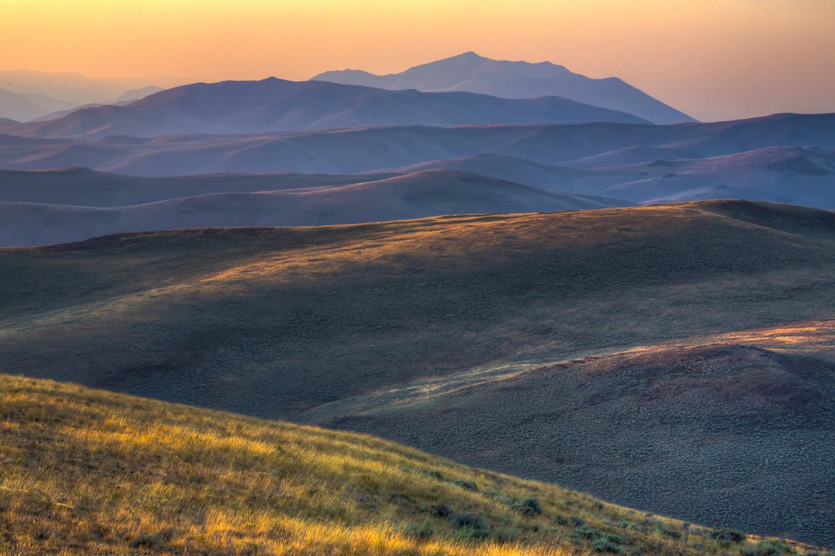 The view over a patchwork of rolling hills at the Jim McClure-Jerry Peak Wilderness Area mimics a painting