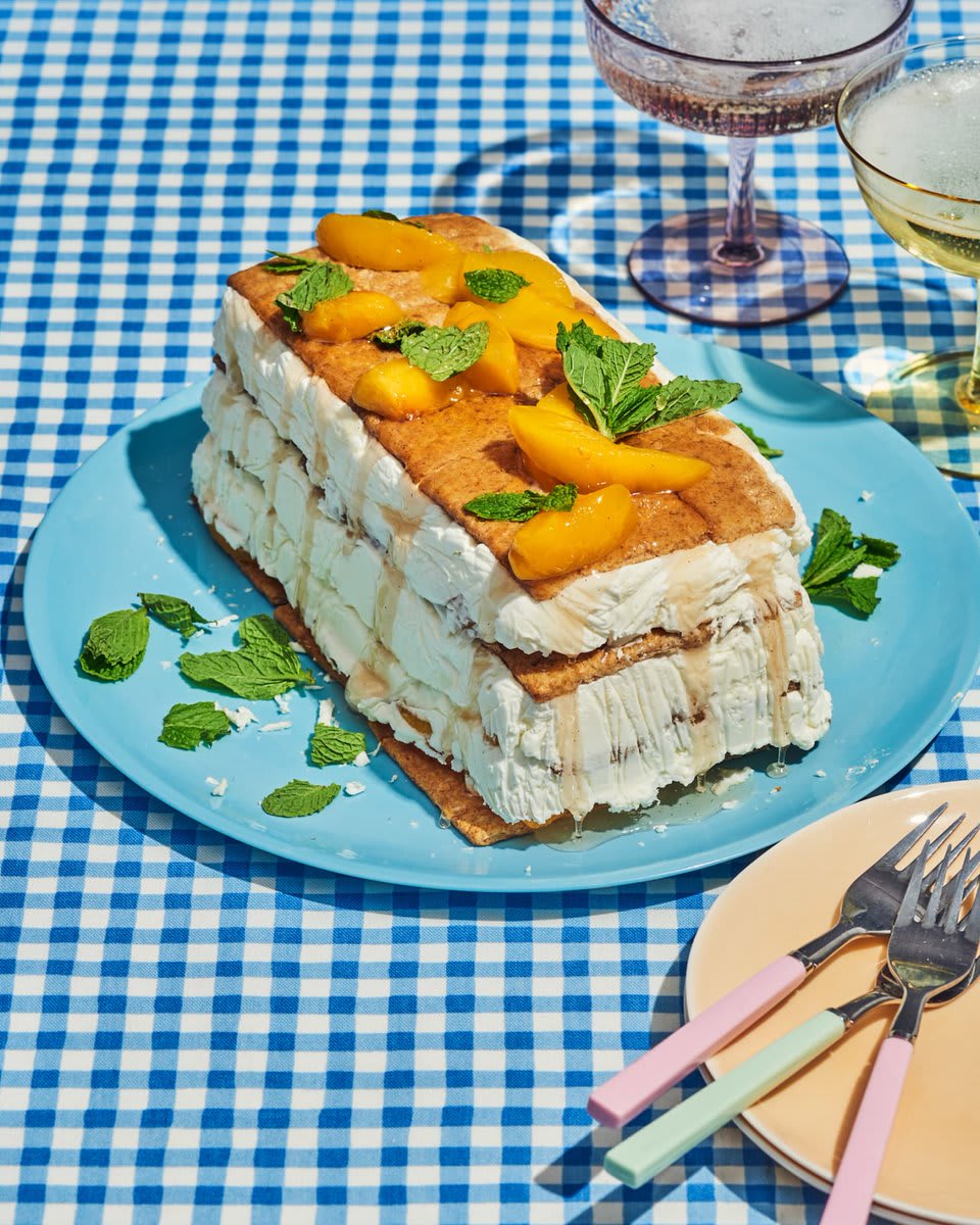 @justintsburke’s Peach Delight Icebox Cake is a true delight: simple in appearance, with sweet and fresh flavors, and boozy peaches poached in Prosecco:
