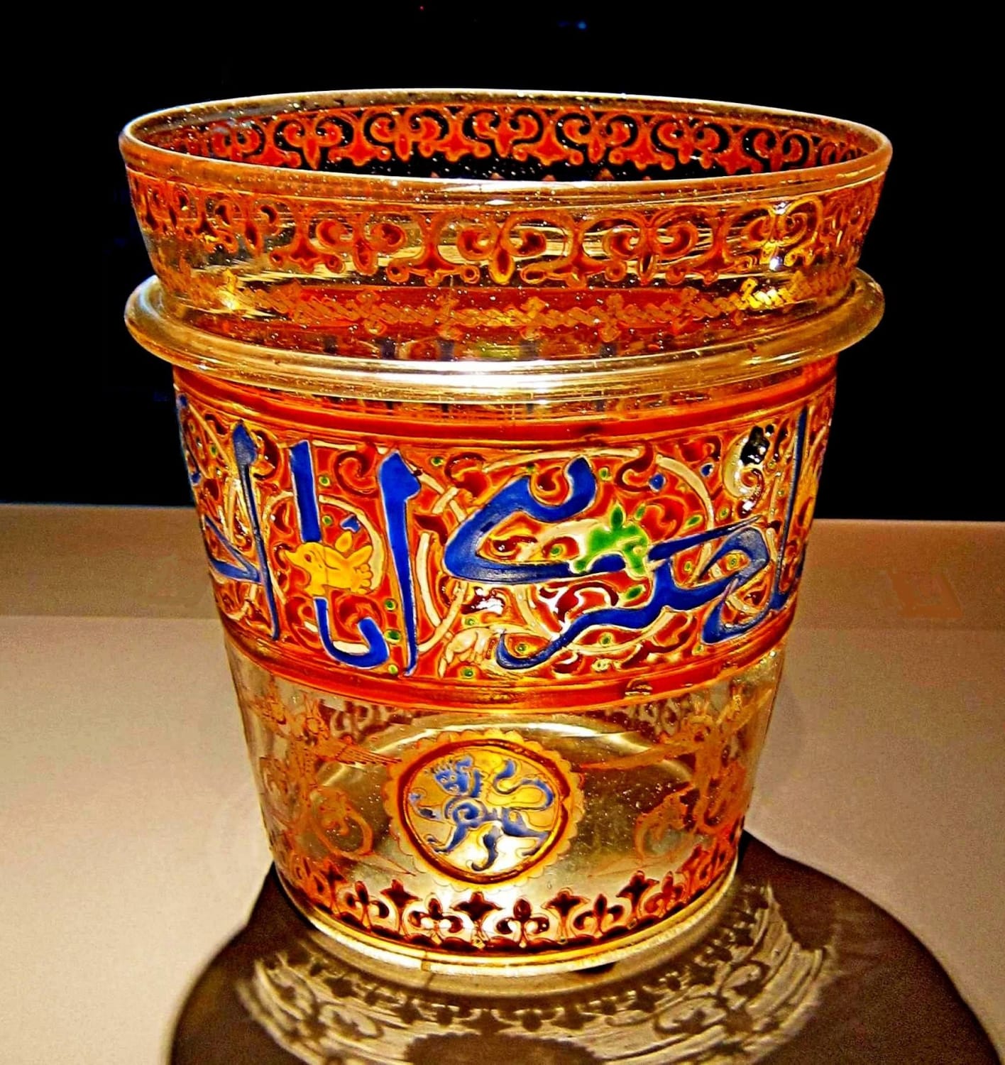 A Mamluk enamelled glass bucket made either in Egypt or Syria. Mid 14th century CE, it was sold at sotheby's in 2009 and is now in the permanent collection of the Museum of Islamic Art in Doha, Qatar