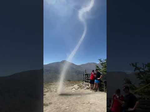 Person Witnesses Dust Devil Formation While Hiking in Mountains of Chile - 1200958
