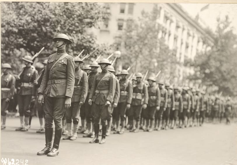 "Parade and review of Marines, Second Division, Washington, D.C. Company marking time in column of squads" 100 years ago