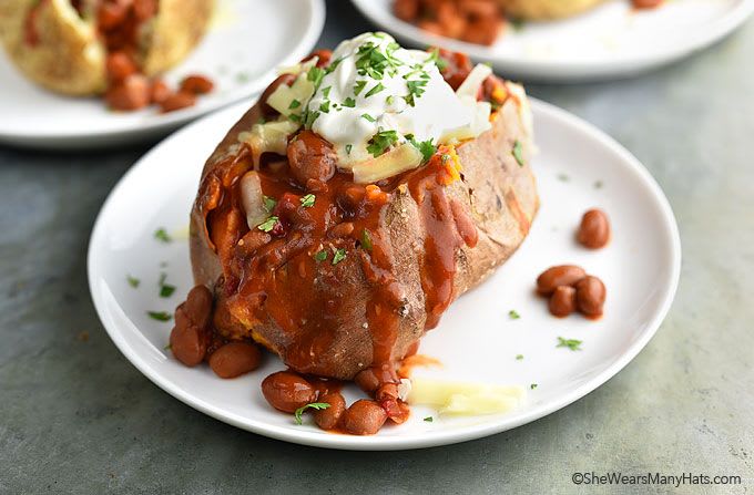 Spicy Loaded Baked Potato | She Wears Many Hats Topped with Sriracha Beans, cheese and sour cream, a Spicy Loaded Baked Potato is a super easy and satisfying meal.