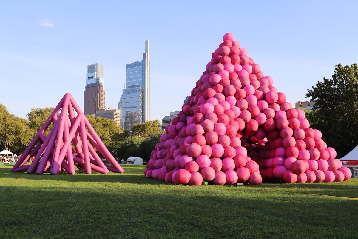 Pink inflatable tubes and spheres form immersive pyramid installations by Cyril Lancelin