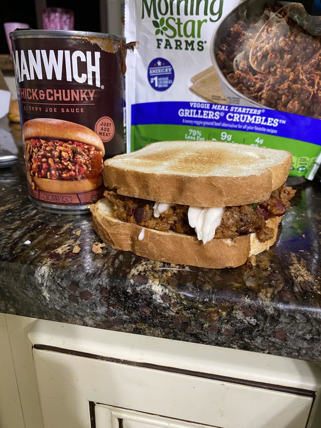 Manwich with onions, tomatoes, spinach, kidney beans and good karma sour cream.