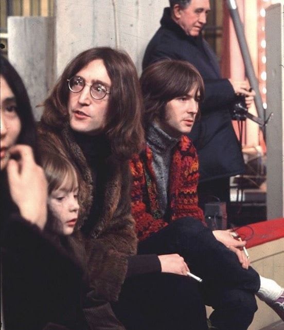 John Lennon with his son Julian Lennon and wife Yoko Ono photographed with guitarist Eric Clapton at the Rolling Stones’ Rock and Roll Circus, 1968.