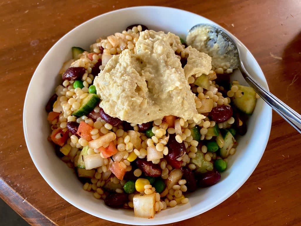 Extremely minimal prep Israeli couscous ‘salad’ with giant blob of garlic hummus.