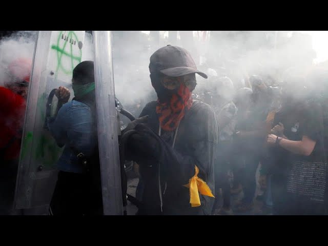 Feminist protesters battle with police in Mexico City