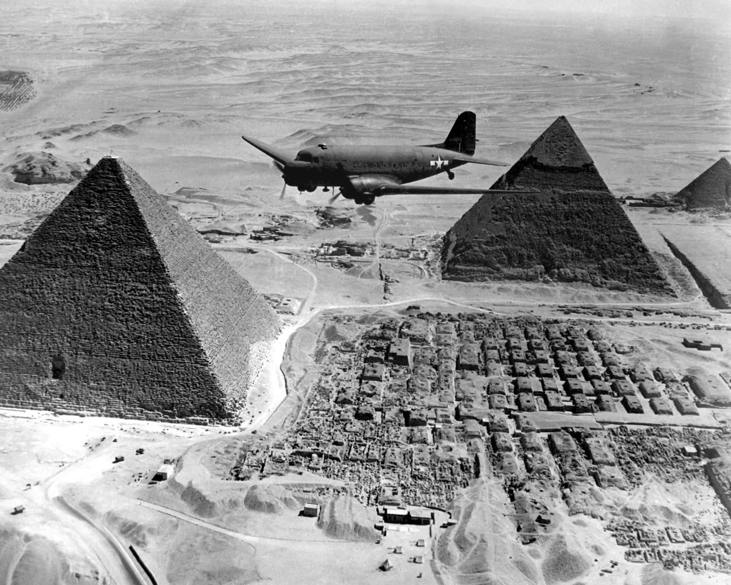 Transport plane flies over Egyptian Pyramids - 1943