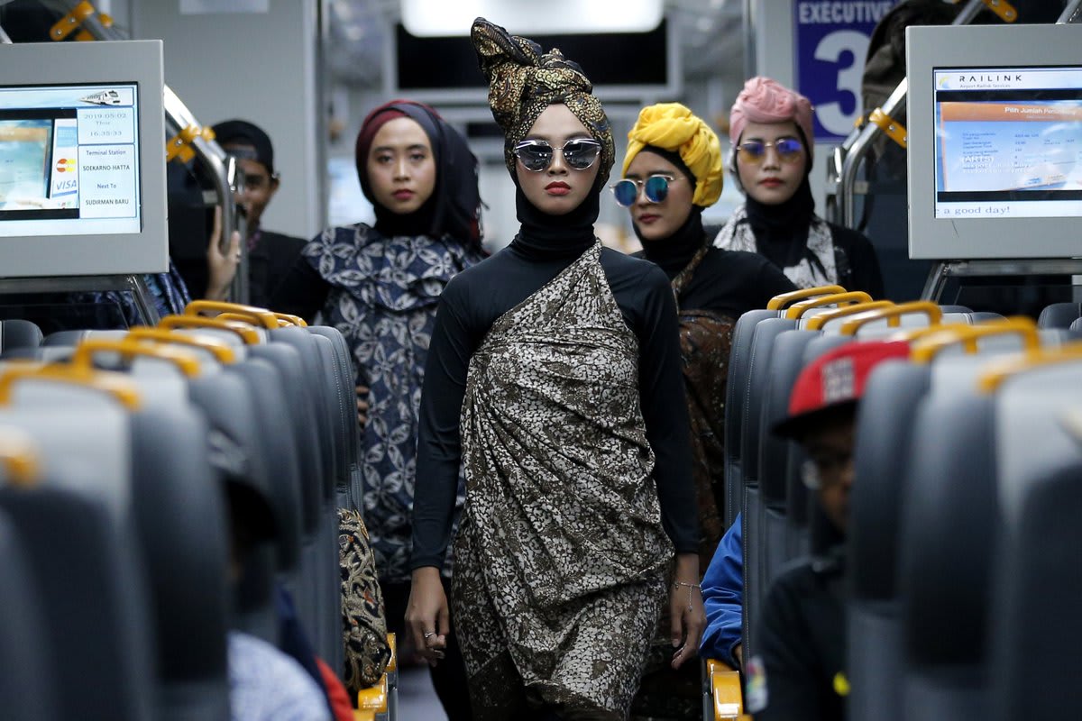 Models perform during a Muslim fashion show an airport train in Jakarta, Indonesia. Picture by AP Photo/Tatan Syuflana See more in our Pictures of the Day gallery