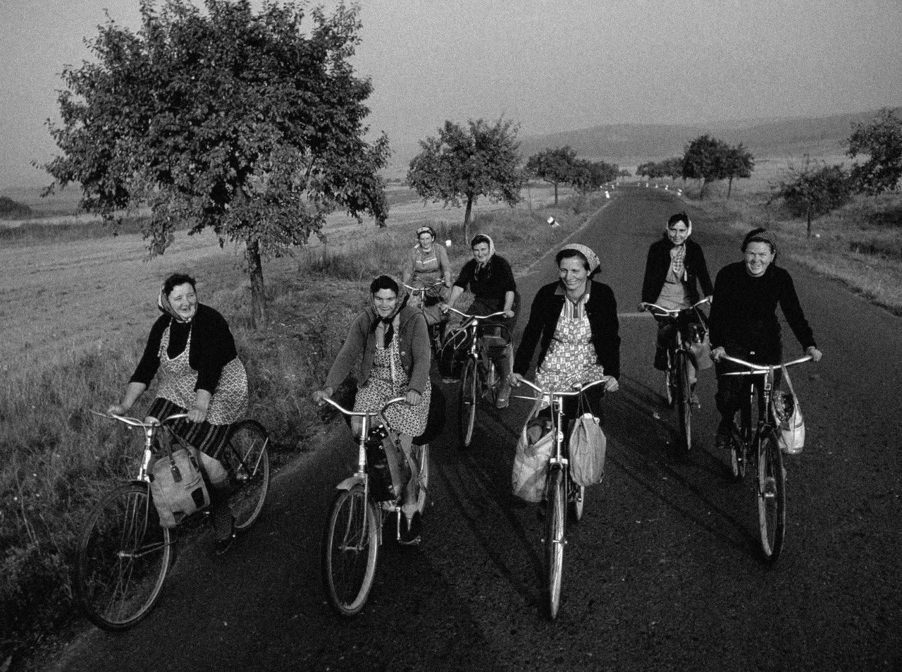 Women Ride Home from the Fields, Little Carpathians, Czechoslovakia, 1968. by James P. Blair.