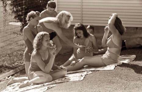 Sunbathing at the city pool in Caldwell, Ohio, 1941.