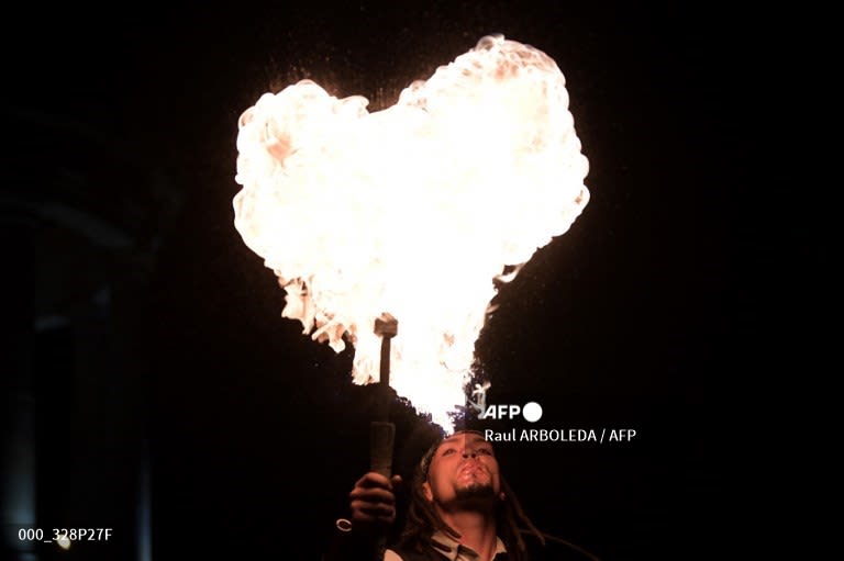 Colombia - A juggler performs with fire in a street of Bogota.