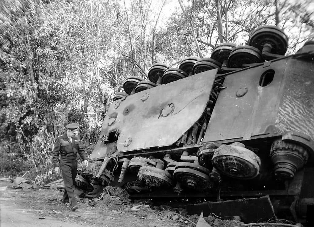 General Dwight D. Eisenhower inspects an overturned Tiger II tank in the Falaise-Chambois pocket in France, August 1944