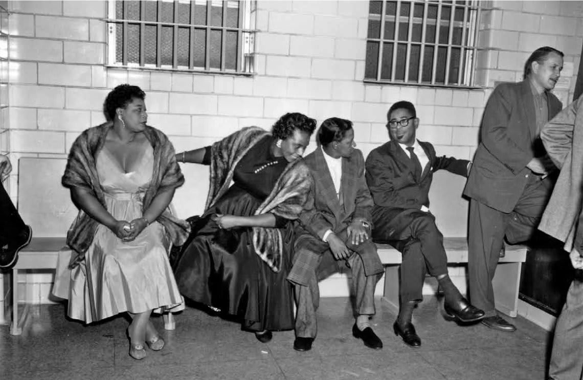 Ella Fitzgerald, her personal assistant Georgiana Henry, Illinois Jacquet, and Dizzy Gillespie share a jail cell in 1955 for playing to an integrated audience.