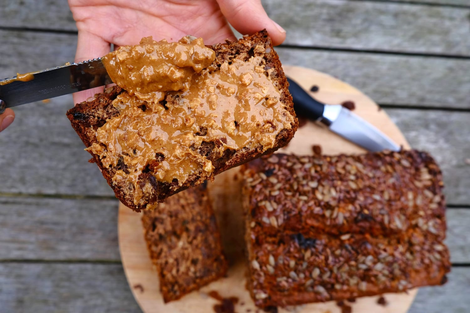 Insanely good and simple to whip up vegan banana bread with seeds and raisins for slow-release energy, the perfect outdoor snack smothered in peanut butter.