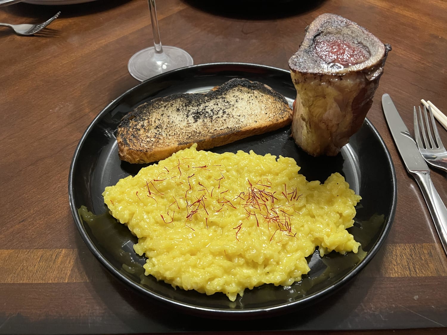 Saffron risotto with roasted bone marrow and marrow grilled bread last night. The leftover risotto will become arancini today.
