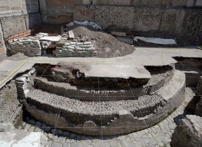 From the Archives: Sections of a large circular temple dedicated to the Aztec god of wind and part of a ritual ball court were uncovered in downtown Mexico City.