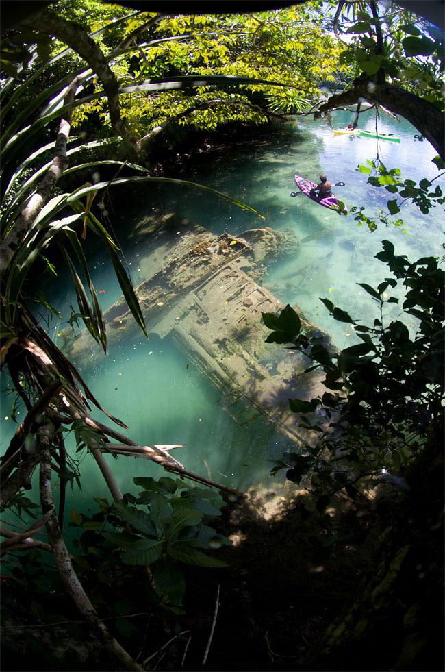 Japanese WWII Warplane Lies Wrecked in Tropical Riverbed in Palau