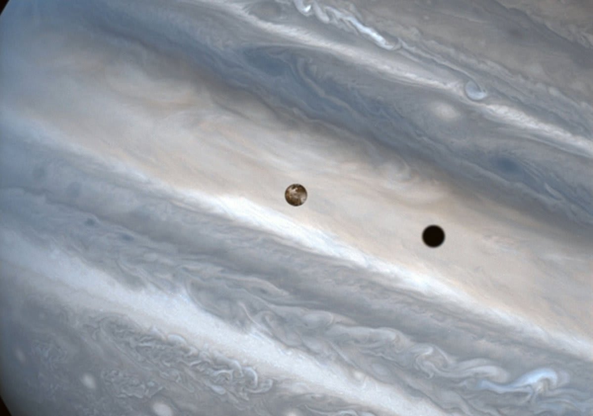 Day 10 of the 2016 Hubble Space Telescope Advent Calendar: Jupiter's moon Io casts a shadow across the cloudtops -