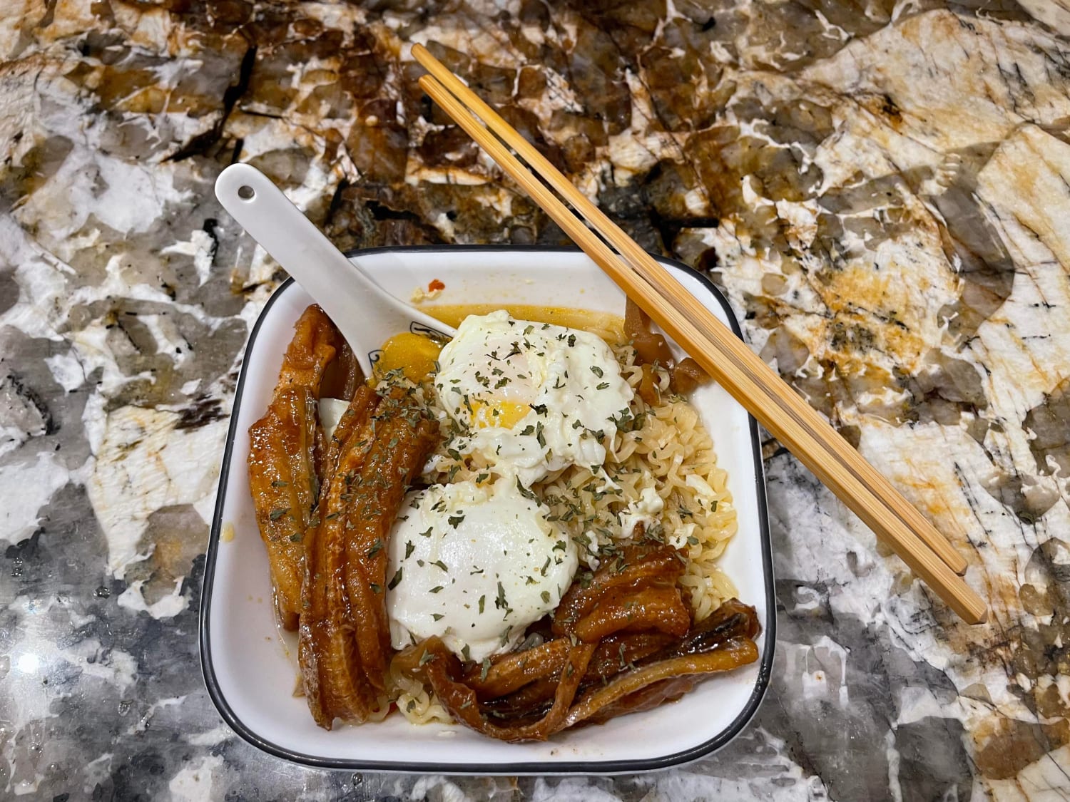 I made budget ramen. Instant store ramen, two poached eggs, chili radishes from a jar, and canned eel in bean sauce. Splash of soy sauce and sesame oil, sprinkle of parsley.