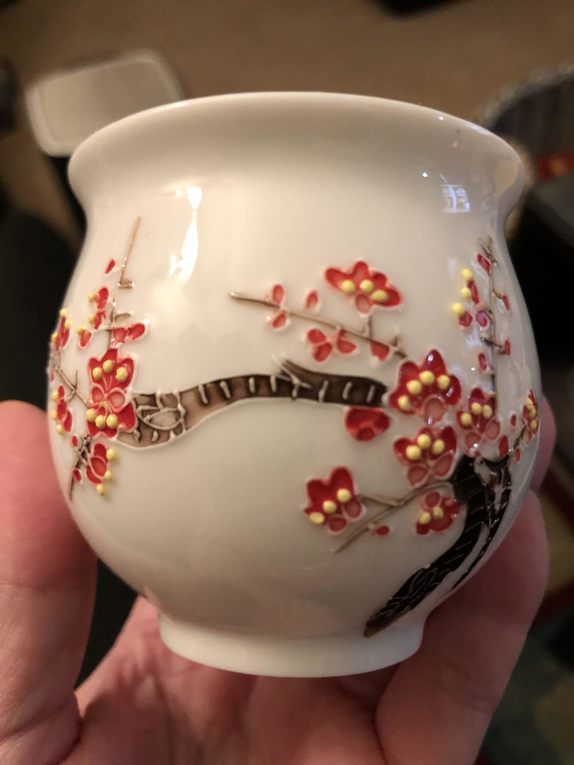 My friend recently broke his teacup and I wanted to help him out by trying to find the same one for him (the company name is Jingdezhen and the flowers on it are plum blossoms)