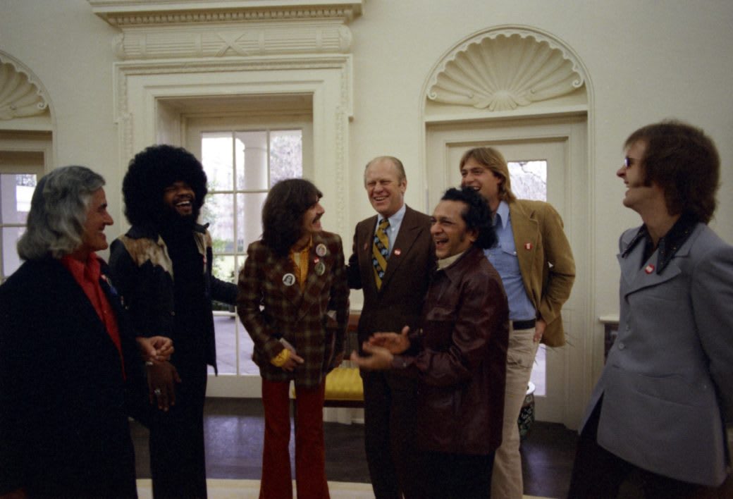 President Gerald R. Ford and his son, Jack Ford, meet with George Harrison, Harry Harrison, Billy Preston, Tommy Scott, and Ravi Shankar in the Oval Office, 1974