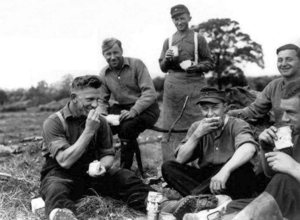 German PoWs take a break on a farm in Essex, April 1945.