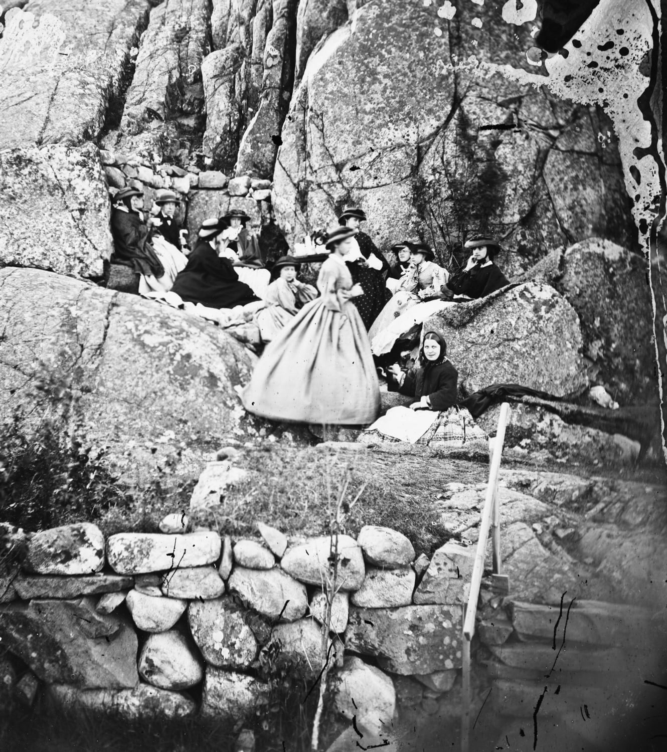 Ladies drinking coffee among the cliffs. Two of them are smiling - quite rare in photos from this time. Lysekil, Sweden in the 1860's.